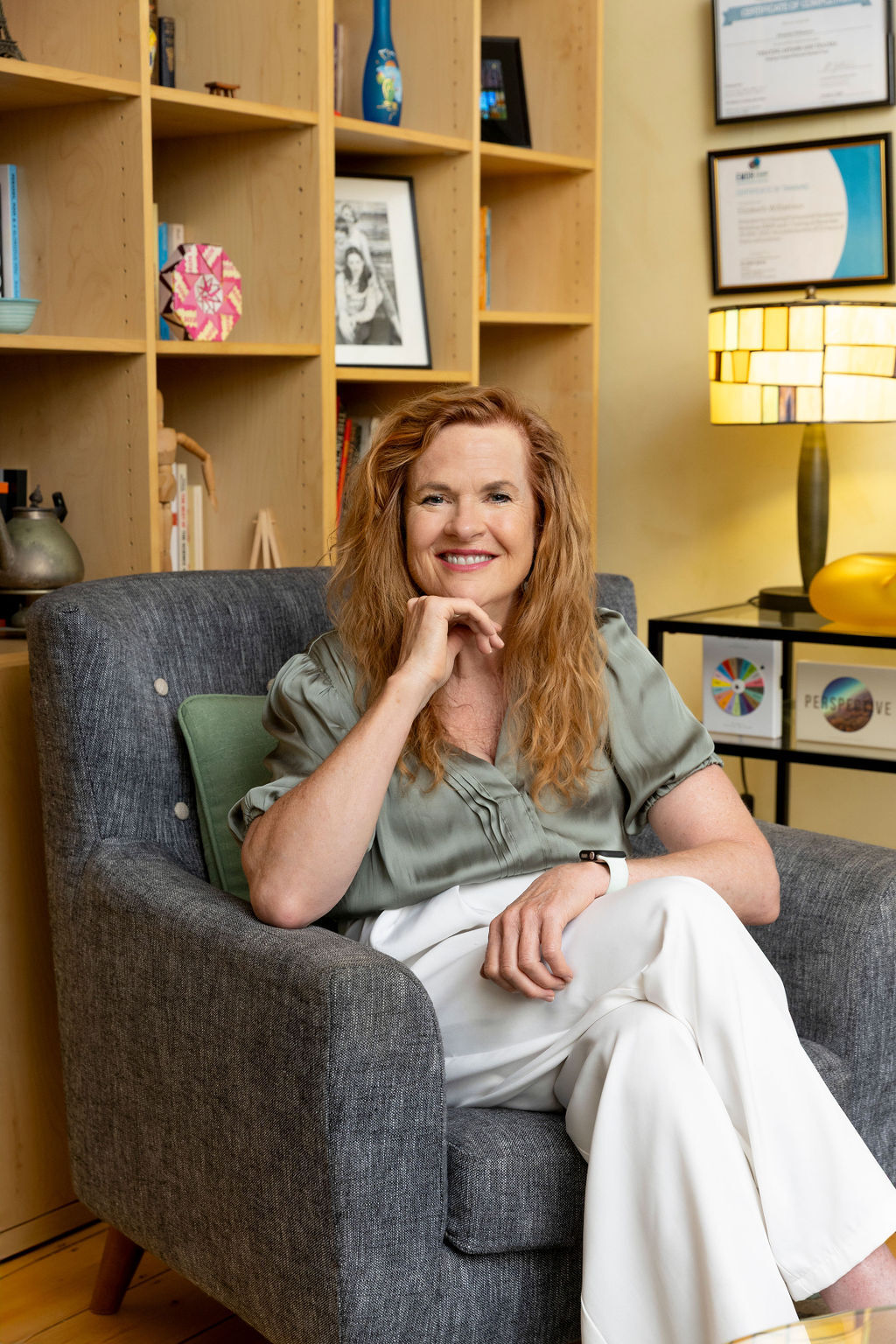 Elizabeth seated in her consulting room