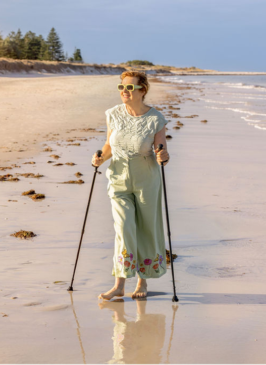 Elizabeth walking along the beach